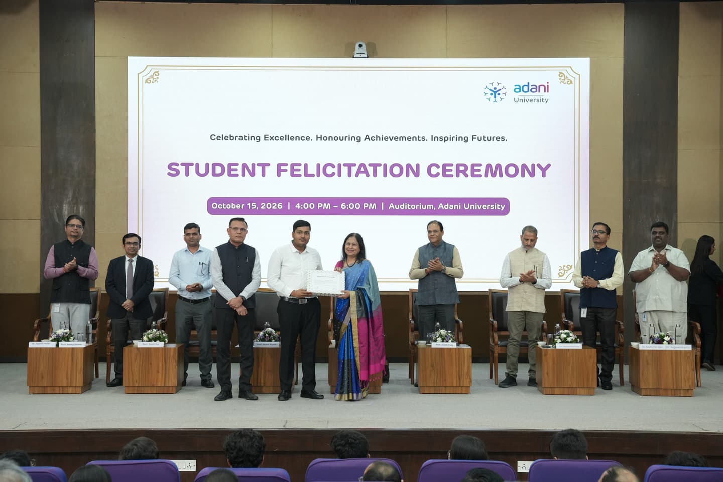 Felicitated by Dr. Priti Adani on stage at the Adani University Student Felicitation Ceremony.
