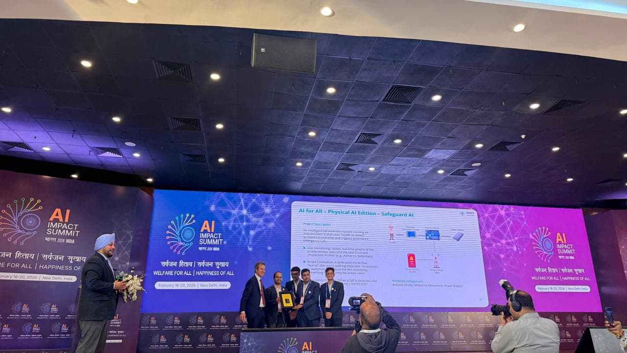 Receiving the National Winner recognition on stage from Arduino CEO Fabio Violante for SafeGuard-AI.