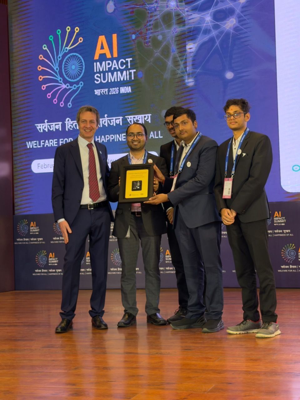 Receiving the Top Innovator award on stage from Arduino CEO Fabio Violante for our project, SafeGuard-AI.